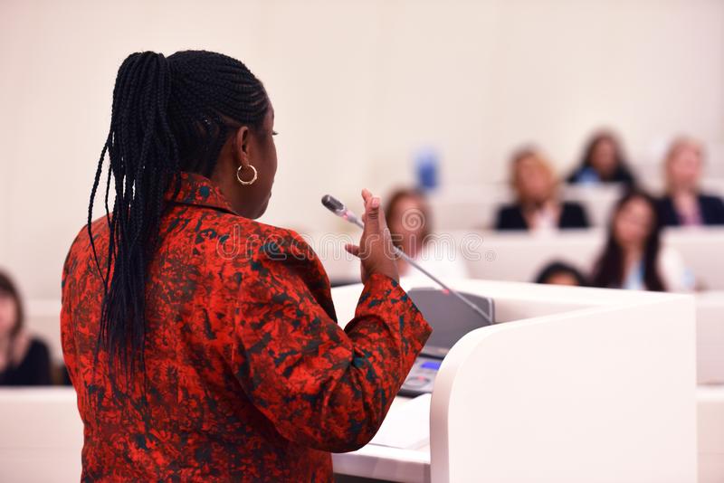 African women speaking at confrance